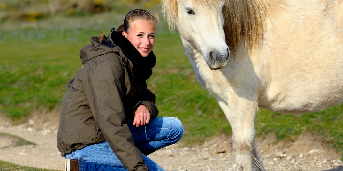 A young woman with a pony