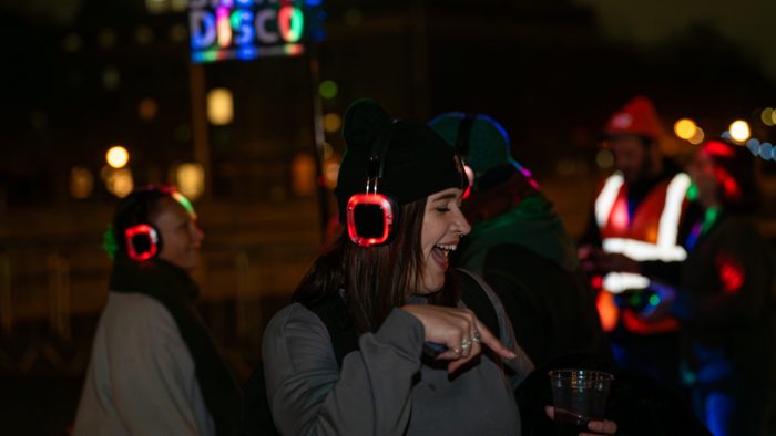 A person wearing headphones dancing.
